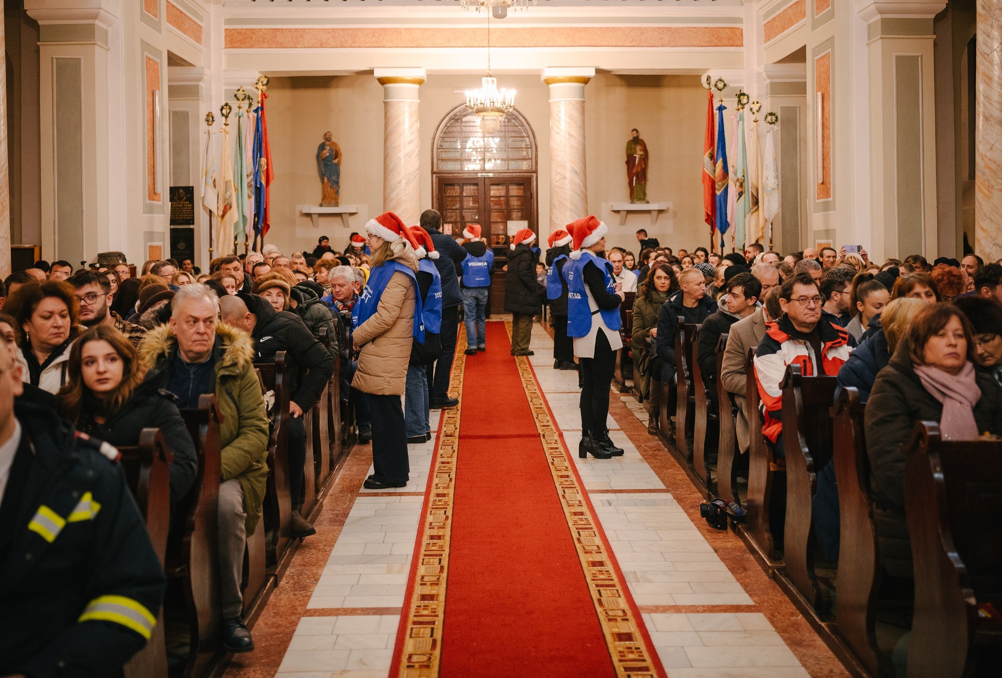 ASSIST Humanitarian Foundation volunteers tending to the audience