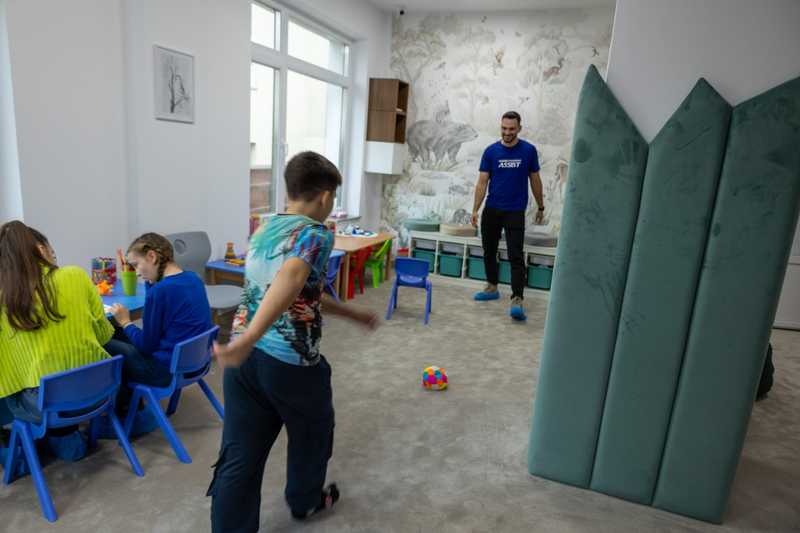 Volunteer playing with one of the children attending the centre.